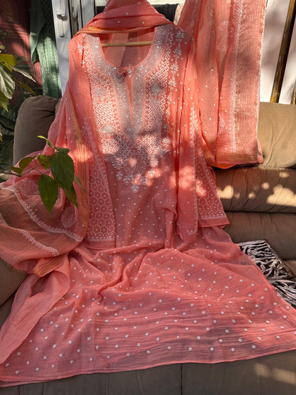 Peachish Orange Mulmul Ensemble Chikankari Elegance with Cutdana & Pearl Highlights