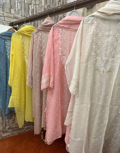 Refined Radiance: Mulmul Chikankari Set with Pearls, Cutdana & Cotton Bottom
