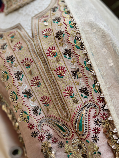 kurta is paired with a graceful sharara and dupatta