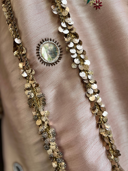 kurta is paired with a graceful sharara and dupatta