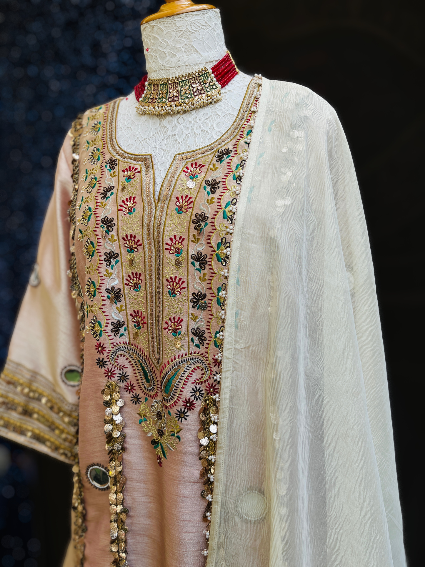 kurta is paired with a graceful sharara and dupatta